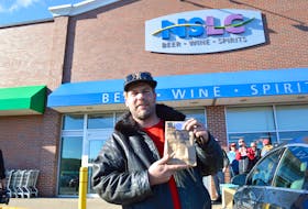 Renowned Cape Breton fiddler Ashley MacIsaac was the first customer to purchase cannabis at the Nova Scotia Liquor Corporation’s Sydney River outlet after waiting outside the Keltic Plaza location the entire night before marijuana became legal in Canada on Oct. 17, 2018. CAPE BRETON POST FILE PHOTO