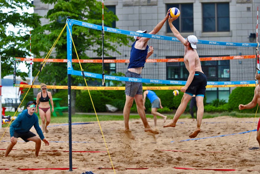 FOR WAKE UP:
 People play sand volleyball on the waterfront in Halifax Saturday June 19, 2021.