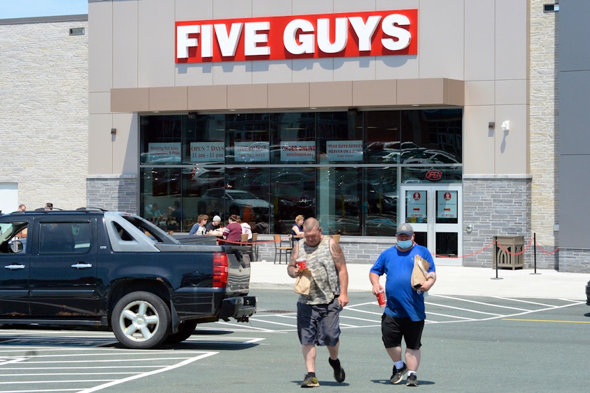 Hundreds of people walked through the doors of Five Guys Burgers and Fries restaurant during its grand opening at the Avalon Mall Tuesday. - Keith Gosse