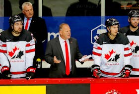 Summerside native and Team Canada head coach Gerard (Turk) Gallant, front, second left, questions a call during a quarter-final game against Russia at the 2021 International Ice Hockey Federation (IIHF) world championship in Latvia recently. Assistant coach Mike Kelly, back left, of Charlottetown looks on.  The New York Rangers introduced Gallant as the team's 36th head coach during a media conference over Zoom on June 22.