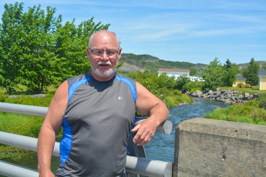 Salmon Cove resident Gary Butt has concerns that the greenish-blue tint of the waters around Salmon Cove are a byproduct of a water treatment facility in nearby Victoria.  - Nicholas Mercer