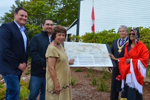 Former West Nova MP Colin Fraser, Bear River First Nation Band Coun. Fred Robar-Harlow, Elder Judy Pearson, and former Annapolis Royal Mayor Bill MacDonald join Elder Katherine Sorbey at the Oqwa’titek interpretative panel in Annapolis Royal in this photo from 2017. Presenters Dr. Marie Batiste, Dr. John Reid, Mercedes Peters and Dr. S. Karly Kehoe signed on to participate in an online dialogue moderated by Bill MacDonald, former mayor of Annapolis Royal, hosted June 26 at 6 p.m. The event is part of a larger series exploring the relationships between the Mi'kmaq and early Scottish settlers. The event is part of Annapolis Royal’s ‘Beyond Oqwa’titek’ initiative. – Lawrence Powell