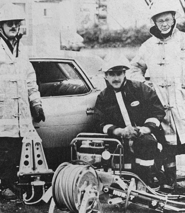 Peter Fraser, of Code 4 Rescue out of New Glasgow, visited Windsor in June 1986 and presented a Jaws of Life rescue unit to the Hants County Fire Fighters Association. Pictured receiving the tools of the trade were Fred Fox, kneeling, and Chief Walter Stephens, of the Windsor Fire Department. - File Photo