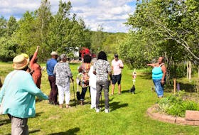 Karen Patterson provides those who took in the renaming of Martin Drive to Reddick Lane on June 17, to honour her family’s legacy, with a family history tour.