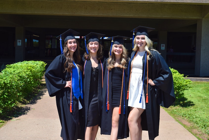 Olivia Krzywanos, Emily O’Connor, Julia Deuville and Kate Vandermeulen booked their graduation appointments consecutively. The group of friends remember seeing graduates taking photos outside of their pre-school when they were little. - Chelsey Gould