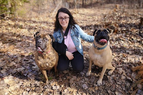 Heidi MacLean of Wilmot recently launched a GoFundMe campaign called “The Cost of Muscular Dystrophy” in hopes of raising some money that will help offset rising medical costs associated with a chronic condition that she hopes to have surgically corrected in early July.
She is pictured with her dogs, Django and Justice. – Contributed 
