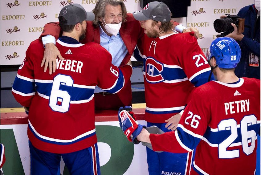 Montreal Canadiens general manager Marc Bergevin congratulates defenceman Shea Weber, centre Eric Staal defenceman Jeff Petry after the Canadiens defeated the Vegas Knights to advance to the Stanley Cup final on June 24, 2021.