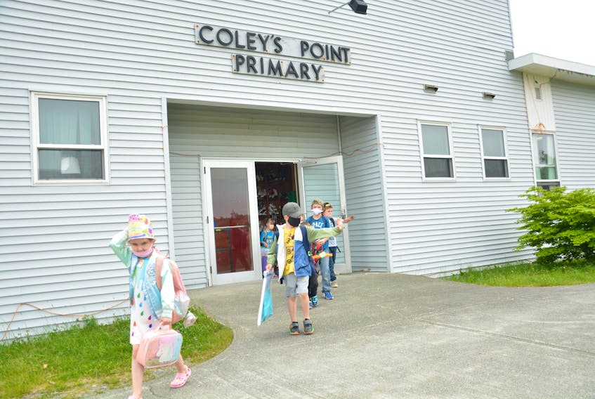 Students at Coley’s Point Primary leave for their buses for the last time on Wednesday.