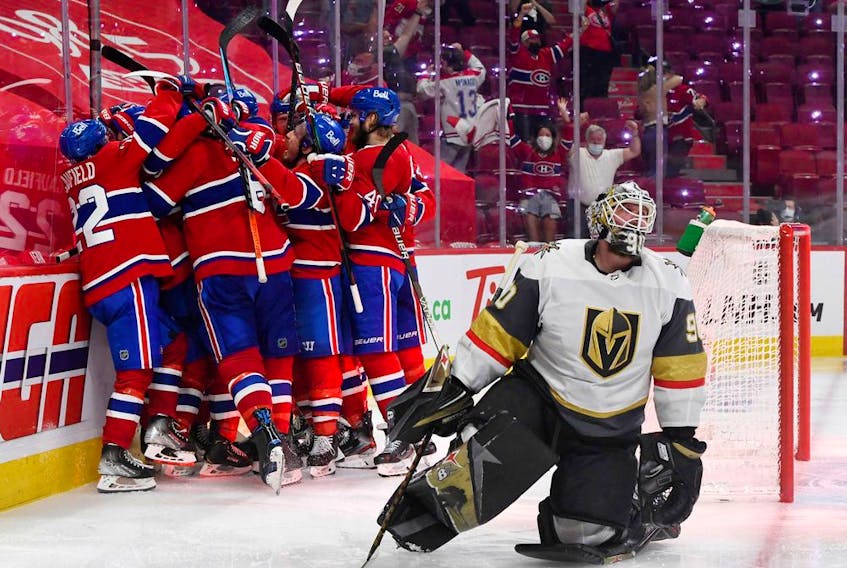 Montreal Canadiens forward Artturi Lehkonen (62) celebrates with teammates after scoring a goal against Vegas Golden Knights goalie Robin Lehner (90) during the overtime period in game six of the 2021 Stanley Cup Semifinals at the Bell Centre. 