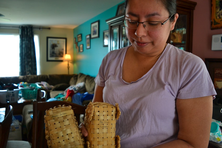 Irena Julian-Bernard holds intricately woven baskets crafted by her late grandmother, Irene Herney, a respected elder in Eskasoni First Nation who was knowledgable in traditional medicine and craft. ARDELLE REYNOLDS/CAPE BRETON POST - Ardelle Reynolds