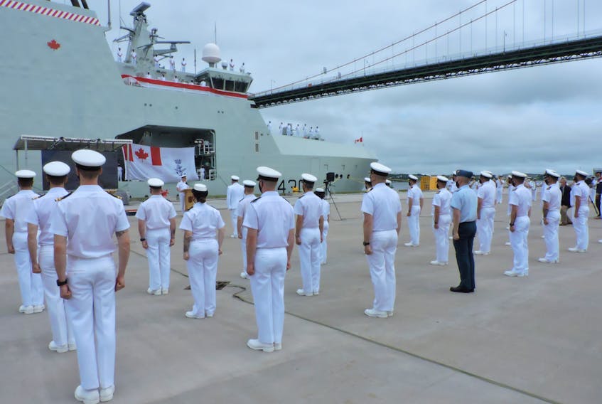 The crew of HMCS Harry DeWolf stands at attention during the new Arctic and offshore patrol vessel’s commissioning ceremony at CFB Halifax on Saturday.