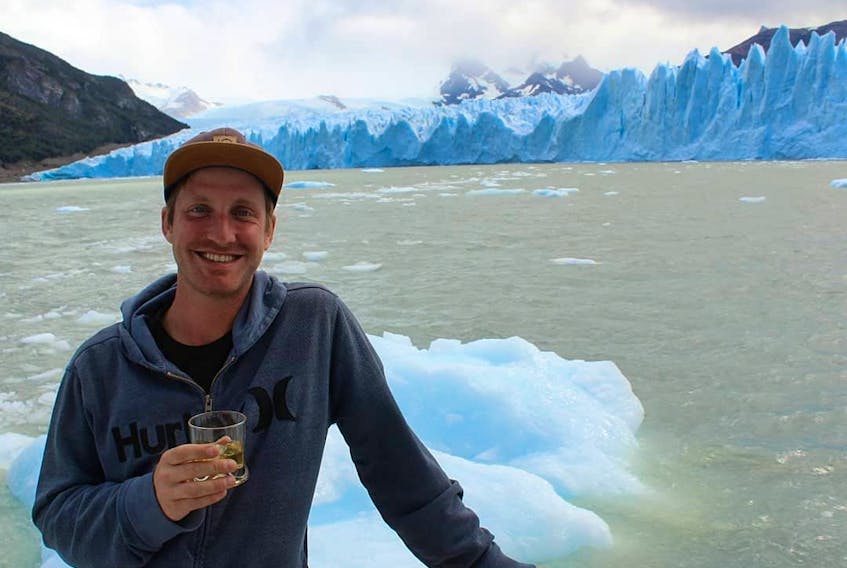 Jason Mullin shown in this undated photo at the end of a trek in Patagonia.