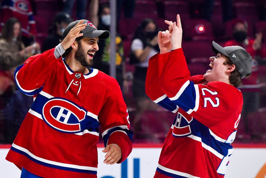 Montreal Canadiens teammates Phillip Danault, left, and Cole Caufield celebrate after winning Game 6 of the NHL semifinals against the Vegas Golden Knights at the Bell Centre. 

