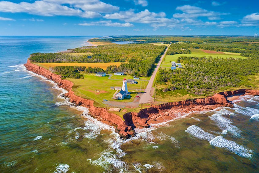 Red sandstone cliffs, rolling green hills and blue ocean awaits visitors along the Points East Coastal Drive in Prince Edward Island. - Photo courtesy Island East Tourism Group.