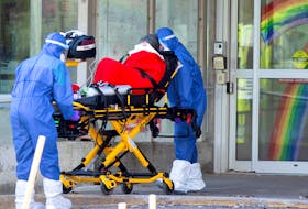  Ambulance attendants transport a resident from a seniors’ long-term care home, amid the outbreak of COVID-19 in Laval, Quebec, April 16, 2020. Quebec “appeared to be the province that came closest to accurately and completely measuring the full magnitude of its COVID-19 fatalities,” a new report says.