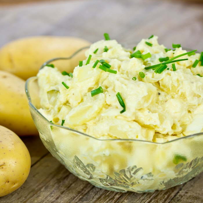 Use some Prince Edward Island potatoes to make a traditional potato salad - it makes a great addition to a summer barbecue. - RF Stock