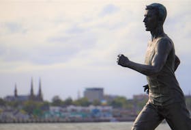 The statue of Mi'kmaq marathon runner Michael Thomas at Diversity Fountain in Stratford appears to run past the Charlottetown waterfront. The two municipalities, like others in Prince Edward Island and across the country, have consulted with Indigenous leaders about Canada Day plans this year.