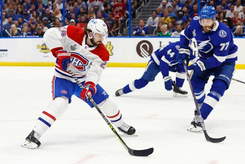 Montreal Canadiens left wing Phillip Danault (left) tries to get around Tampa Bay Lightning defenceman Victor Hedman during Game 1 of the Stanley Cup final on Monday. The Lightning were able to negate Danault during the series opener. 