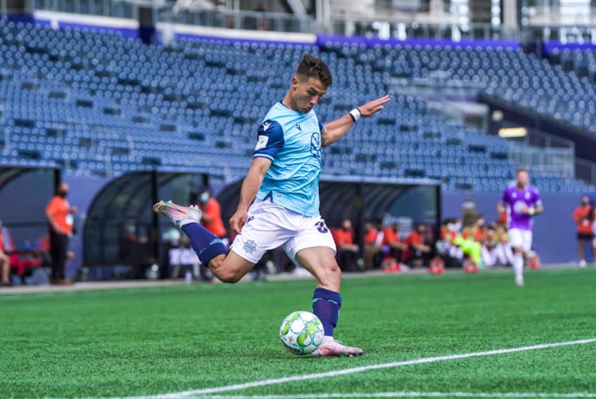 Stefan Karajovanovic of HFX Wanderers FC plays the ball against Pacific FC in a Canadian Premier League game in Winnipeg on Saturday. - CPL/Robert Reyes/William Ludwick)
