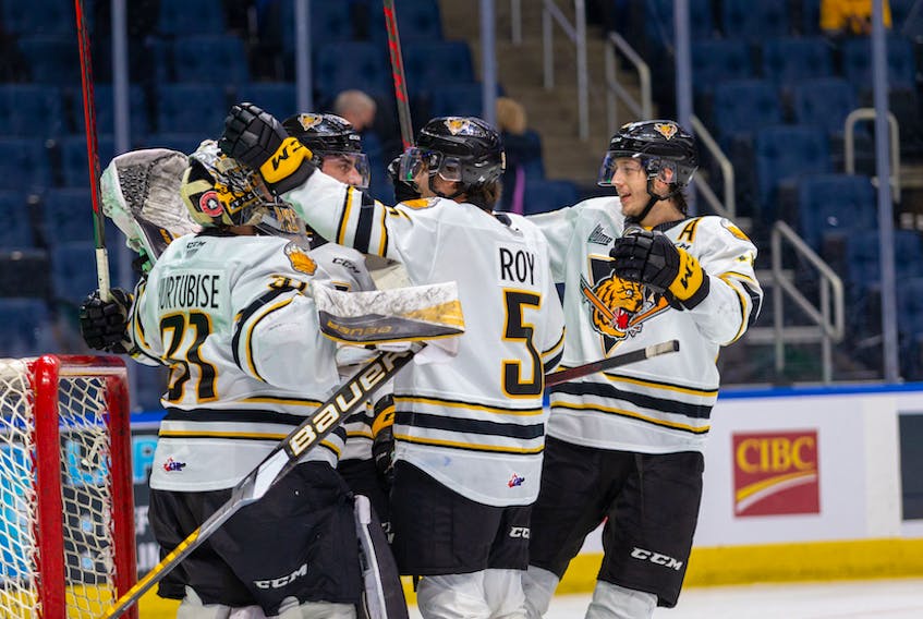 The Victoriaville Tigres celebrate their Game 5 victory over the Val-d'Or Foreurs in the Quebec Major Junior Hockey League final Thursday in Quebec City.