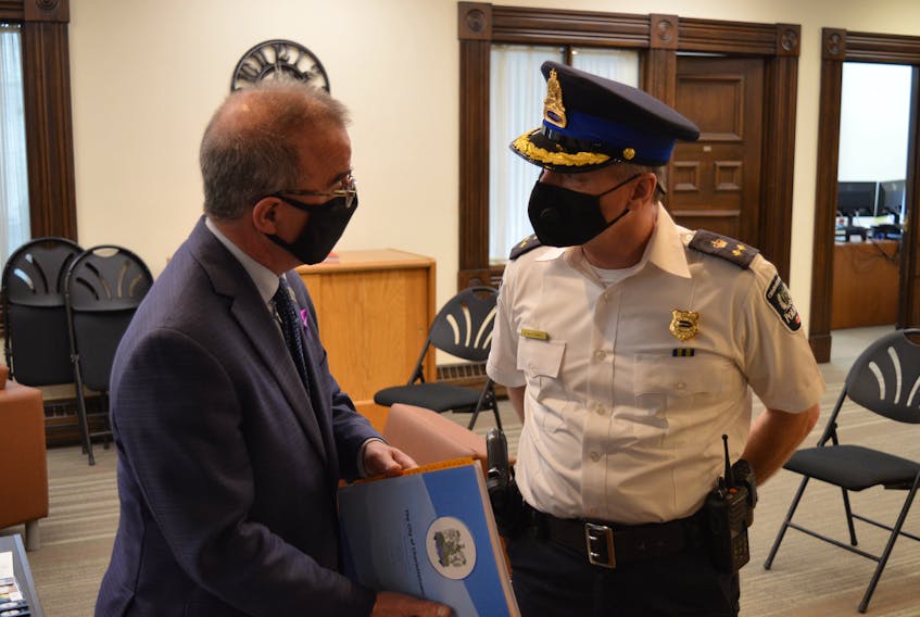 Charlottetown Mayor Philip Brown, left, and Charlottetown Police Services Deputy Chief Brad MacConnell chat before a council meeting earlier this year. 