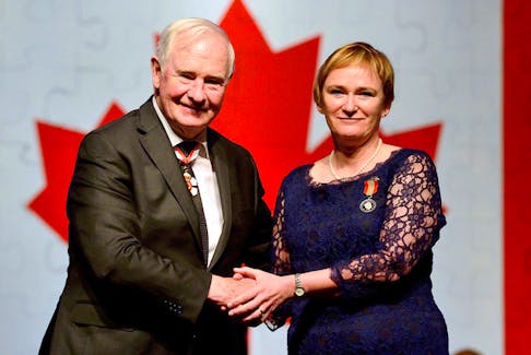 Robin McGee of Port Williams accepts the Sovereign's Medal for Volunteers from Gov. Gen. David Johnston during an awards ceremony hosted in 2016. (Master Cpl. Vincent Carbonneau, Rideau Hall) 