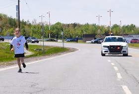 Lexi Barbour, 6, of Truro seen finishing her Marathon of Hope with a Truro Police Service Escort. Harry Sullivan Photo