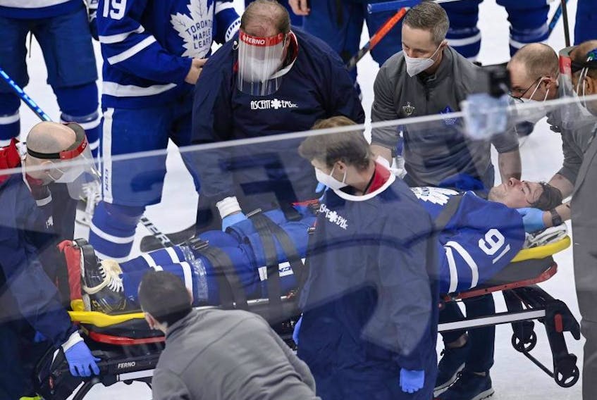 Maple Leafs captain John Tavares is stretchered off the ice in Game 1 versus Montreal on Thursday. THE CANADIAN PRESS