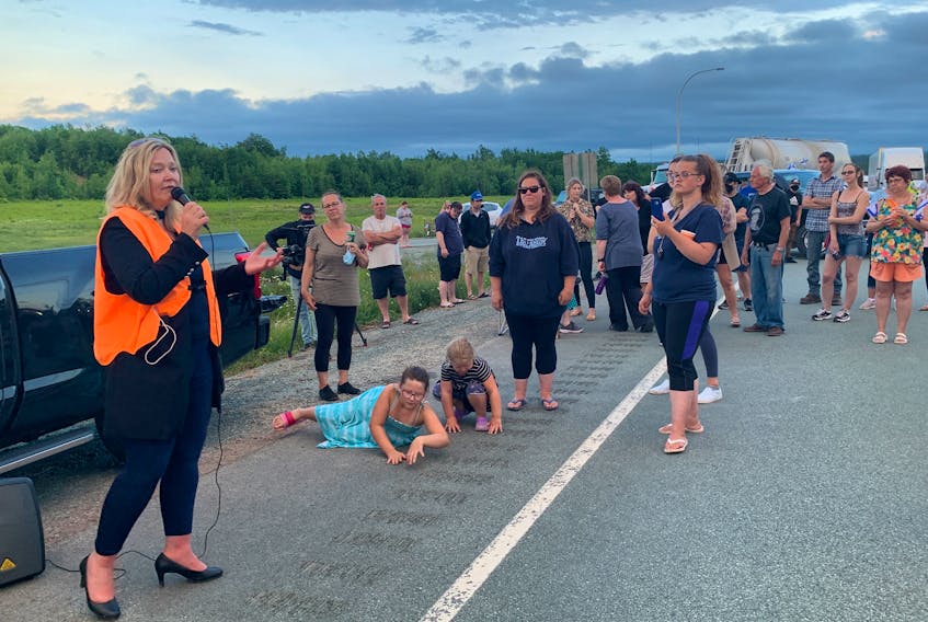 Cumberland North MLA Elizabeth Smith-McCrossin speaks during a blockade on Highway 104 at Thomson Station on Tuesday, June 22. The blockade, which lasted just over five hours, followed an announcement earlier that day by Premier Iain Rankin not to reopen the border to New Brunswick residents, and Nova Scotia residents returning from New Brunswick, without the need to self-isolate. Another blockade later closed traffic at the border for more than 24 hours before RCMP ended it Wednesday night, June 23.