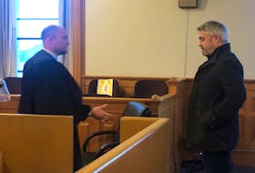 Kurt Churchill, charged June 30 with the murder of James Cody in July 2020, is shown in a St. John's courtroom with his lawyer Robert Ash in November of 2020 when he filed an appeal against providing a DNA sample.
