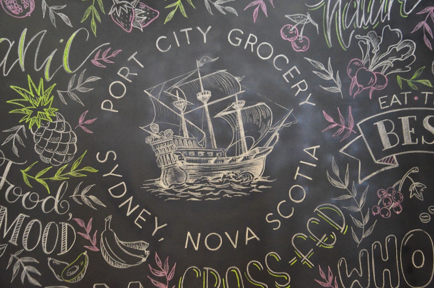 This oversized chalkboard shows off one of the soon-to-open Port City Grocery logos. DAVID JALA • CAPE BRETON POST - David Jala