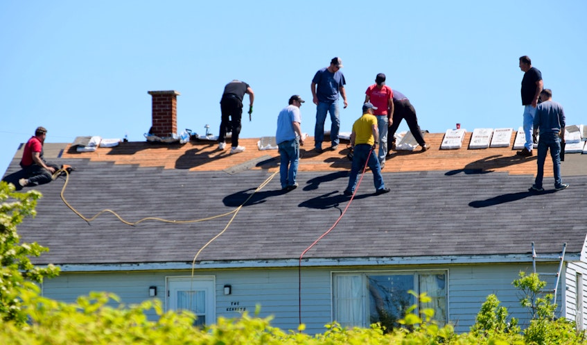 Volunteers came together in Clark’s Harbour on June 24 to put a new roof on a fellow resident’s home that was damaged in 2019 by Hurricane  Dorian. KATHY JOHNSON - Kathy Johnson