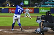 Bo Bichette hits a three-run home run during the sixth inning against the Seattle Mariners.