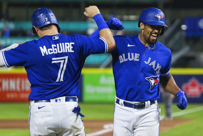  Blue Jays’ Reese McGuire (left) and Marcus Semien celebrate after Semien’s three-run home run during the seventh inning against the Seattle Mariners at Sahlen Field on June 29, 2021 in Buffalo. JOSHUA BESSEX/GETTY IMAGES