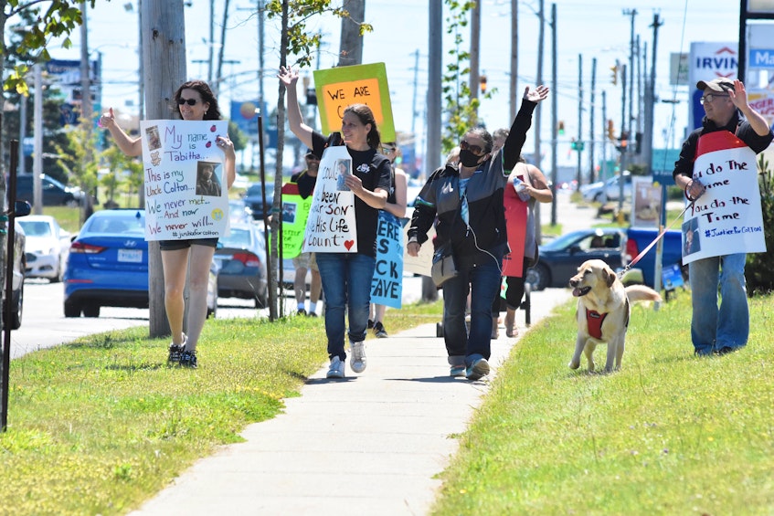 Family and friends, including Stacey Cook, marching in honour of Colton Cook and Zack Lefave – who has been missing since Jan. 1, 2021 – acknowledge honks from passing vehicles during a June 24 awareness march. Another march is planned for Saturday, July 3. Weather permitting, people will gather at the top of the Yarmouth Mall parking lot at 11 a.m. TINA COMEAU • TRICOUNTY VANGUARD - Saltwire network
