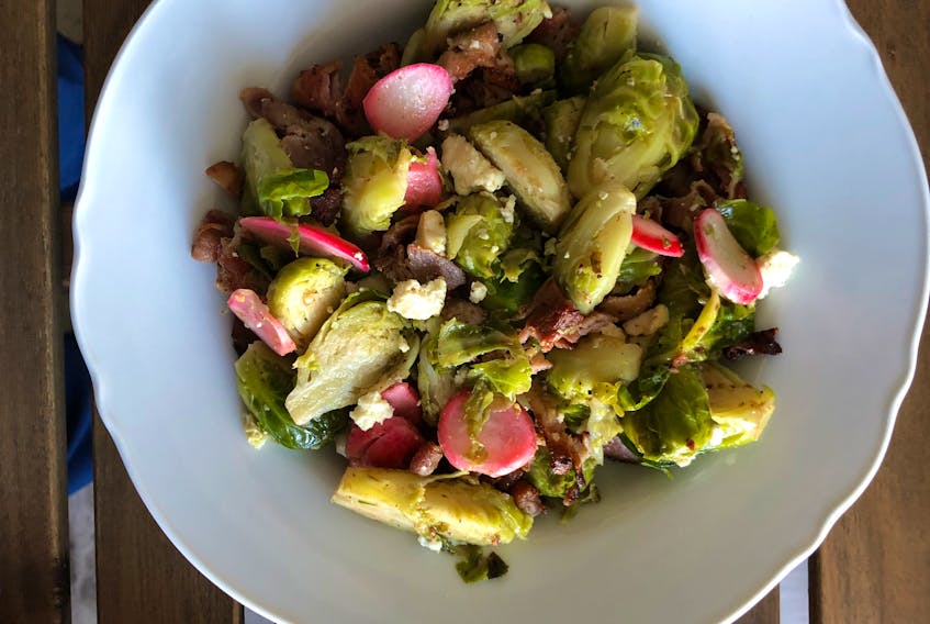 Brussels sprouts get new life in this salad featuring crispy bacon, fresh cheese and radishes.