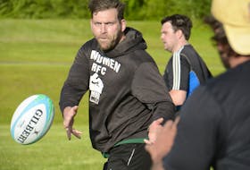 Kyle Robertson makes a pass to a teammate during a recent Charlottetown Rugby Football Club (CRFC) Mudmen practice at Co-op Field in Charlottetown.