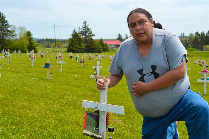 Stephenson Joe, a resident of the Abegweit First Nation in Scotchfort, visits the 215 crosses that were placed just off Route 2. - Dave Stewart