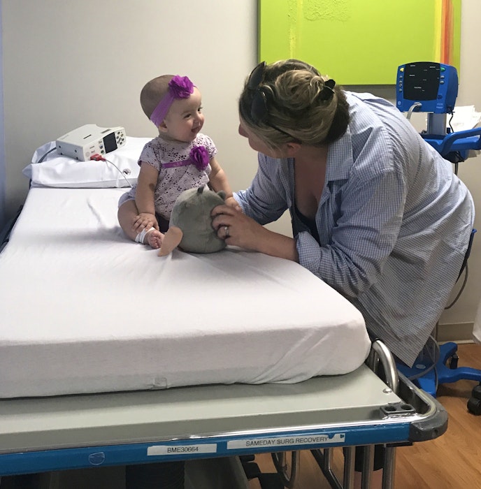 Mom Jennifer MacPherson gets a big smile from her daughter Ella before her first operation in Halifax at the IWK. CONTRIBUTED