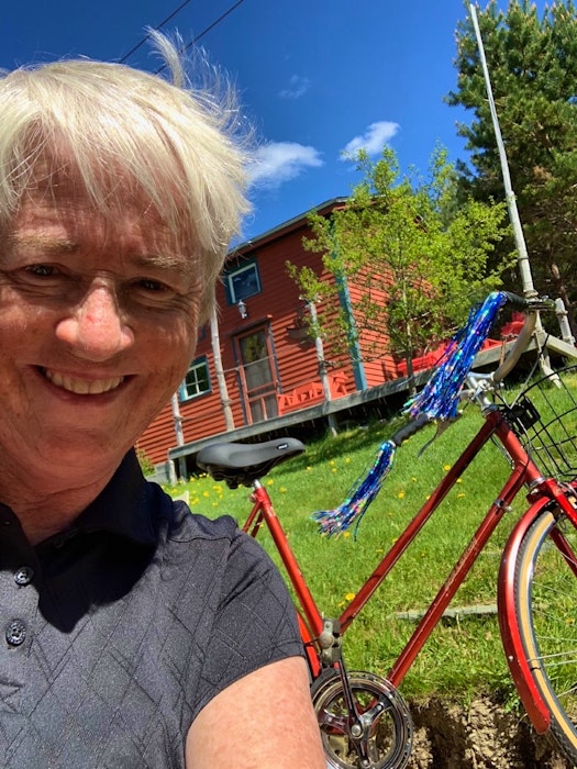 Suzanne Brake poses with her refurbished 1973 Raleigh bike at her home in Cupids. — Contributed