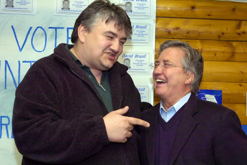 In this 2010 file photo, George Murphy (left), the NDP candidate for the district of Conception Bay East-Bell Island, jokes with Premier Danny Williams after Williams and the PCs won a by-election in the district.. — File photo/Keith Gosse