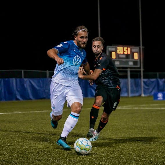 HFX Wanderers defender Peter Schaale, left, battles for the ball against Forge FC during the 2020 Island Games in Charlottetown. The Canadian Premier League will return to a bubble format for four weeks in Winnipeg to start the 2021 season. - Chant Photography