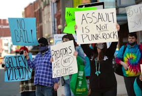 Protesters gather outside provincial court in St. John’s Monday in support of sexual assault survivors. Inside the court a Pouch Cove man was due for a bail hearing on eight sex-related charges against children.