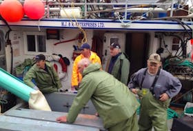 Jason Branton and crew on the deck of Gracie's Adventure during a recent crab fishing trip.