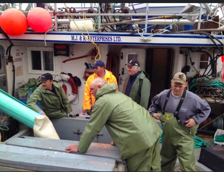Jason Branton and crew on the deck of Gracie's Adventure during a recent crab fishing trip.