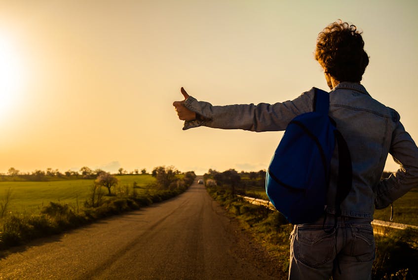 Hitchhiking was a popular means of transportation in the 1960s and 1970s. STOCK IMAGE