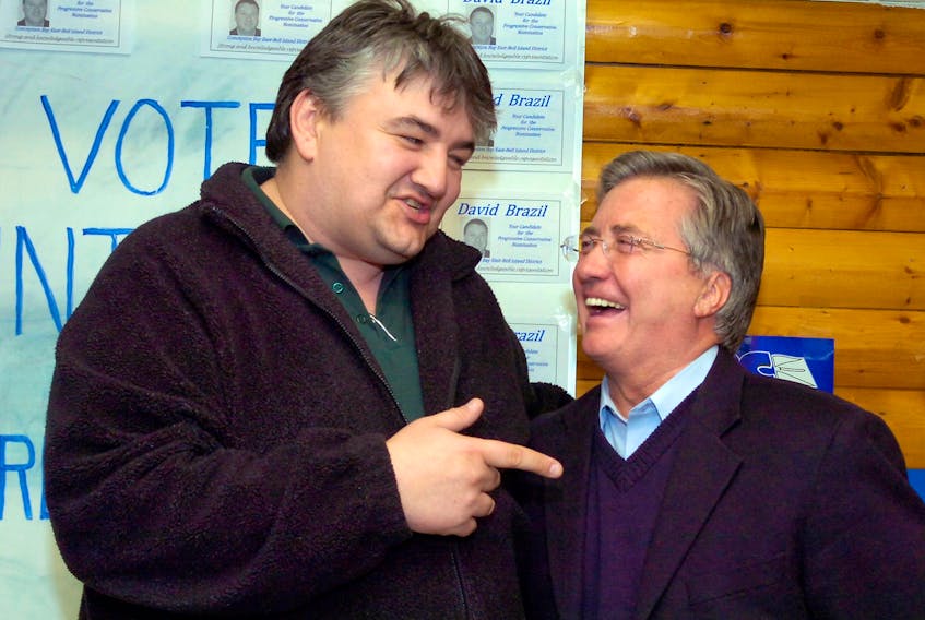 In this 2010 file photo, George Murphy (left), the NDP candidate for the district of Conception Bay East-Bell Island, jokes with Premier Danny Williams after Williams and the PCs won a by-election in the district. - Keith Gosse/File photo