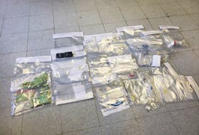 A quantity of cocaine, prescription pills, cash and other items consistent with drug-trafficking were seized following the execution of a search warrant on a Western Bay home on June 4, 2021.