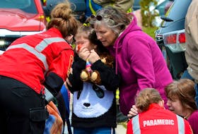 This photo of a family being checked by paramedics after escaping a house fire won the SaltWire Network's Keith Gosse the gold in the Atlantic Journalism Awards' Photojournalism News category.