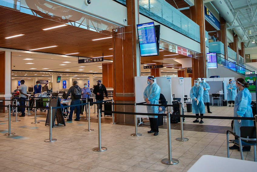 FOR PEDDLE STORY:
Health staff at a COVID19 testing site, await a queue of air passengers, in the arrivals area at Halifax Stanfield Airport Tuesday Jun8, 2021. 

TIM KROCHAK PHOTO